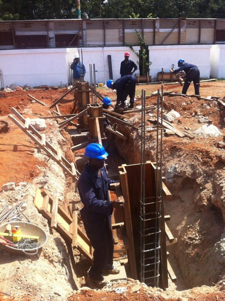 Reinforced concrete column base construction on a housing site