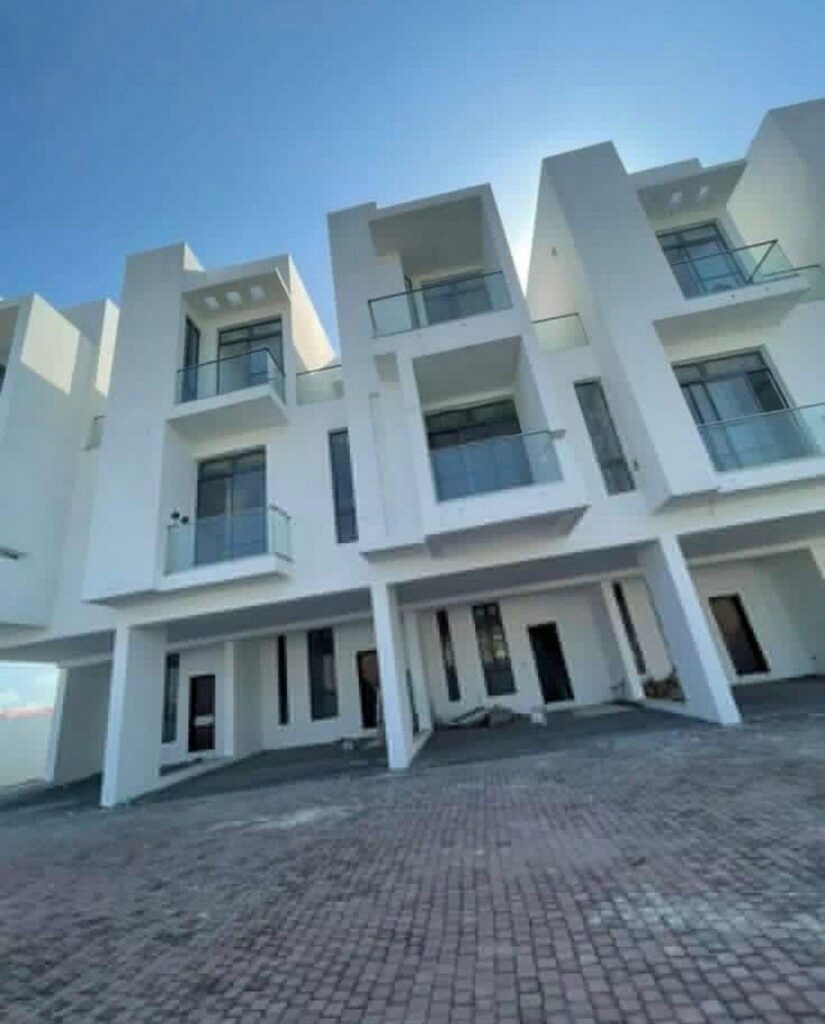 Completed modern white townhouse facades built by Casablanca Real Estates in Accra