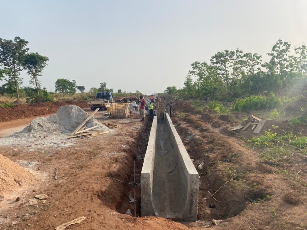 Precast concrete drain channel installed along a rehabilitated feeder road